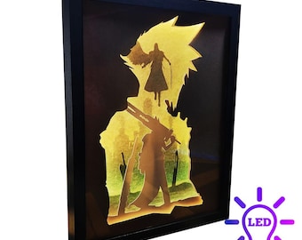 May include: A framed, layered art piece featuring silhouettes of characters against a yellow and green backdrop. The black frame surrounds the illuminated artwork, with an LED light bulb icon in the corner.