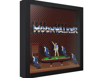 May include: A framed pixel art print of the video game Moonwalker, featuring Michael Jackson in a white suit and black fedora, performing his signature moonwalk on a pool table. The game's title, "Moonwalker", is displayed in a silver and blue font above the scene.