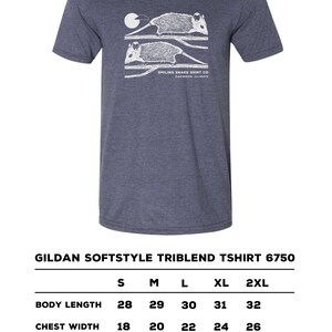 May include: Navy blue Gildan Softstyle Triblend T-shirt featuring a white opossum graphic and the text "Smiling Snake Shirt Co Oakwood Illinois". The shirt has a crew neck and short sleeves. Sizes range from S to 2XL.