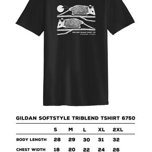 May include: Black Gildan Softstyle Triblend T-shirt featuring a white illustration of two opossums on a branch, with a moon. The text "SMILING SNAKE SHIRT CO OAKWOOD, ILLINOIS" is below the opossums.