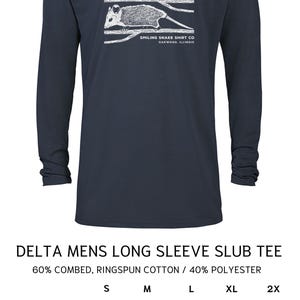 May include: Navy blue long-sleeved shirt with a white illustration of two opossums under a moon. The text "SMILING SNAKE SHIRT CO OAKWOOD, ILLINOIS" is below. The shirt is a Delta Mens Slub Tee.