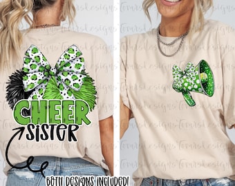 May include: Two beige t-shirts with cheerleading designs. One features a green and black bow with the words "CHEER SISTER". The other has a green megaphone with a bow. The text "BOTH DESIGNS INCLUDED!" is at the bottom.