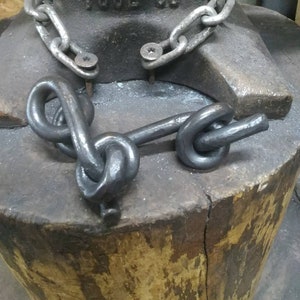 All tied up forged knot sculpture