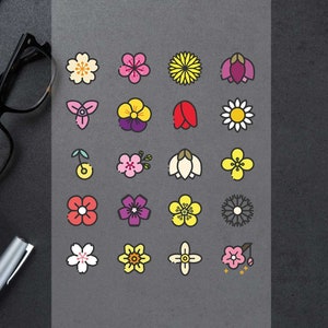 May include: A set of 18 colourful flower icons, each with a unique design. The icons are arranged in a grid pattern on a grey background.