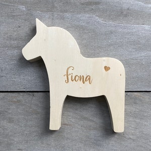 engraved wooden horse