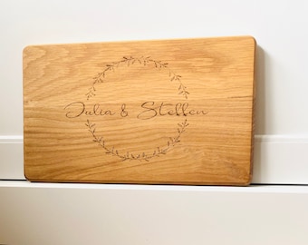 Oak cutting board with two names and wreath