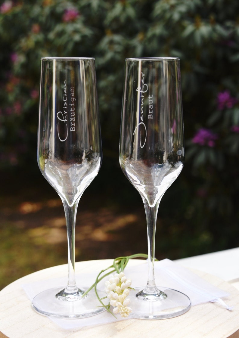 Sparkling wine glasses engraved for the newlyweds Etsy