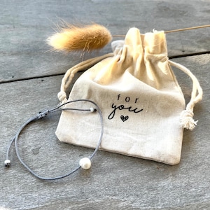 small linen bag with freshwater pearl bracelet