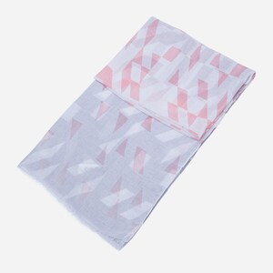 May include: A grey and pink patterned scarf with a geometric design. The scarf is folded in half and has a fringed edge.