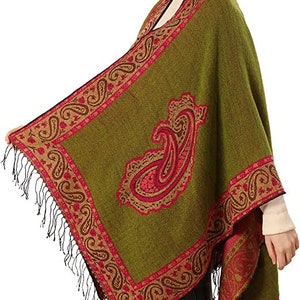 model showing the large paisley desgin on the open front poncho