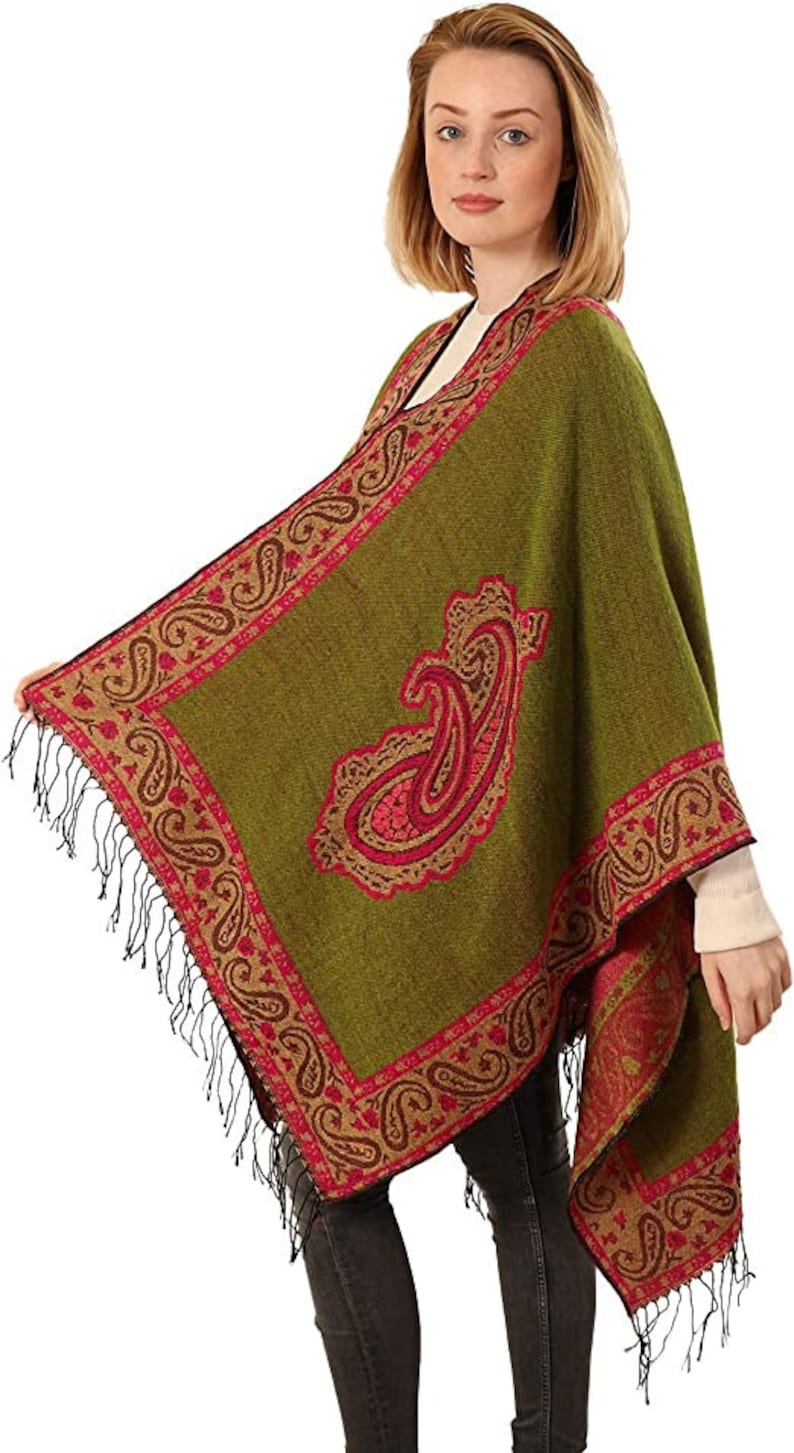 model showing the large paisley desgin on the open front poncho