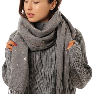 model wearing a warm winter constellation scarf in grey and gold foil