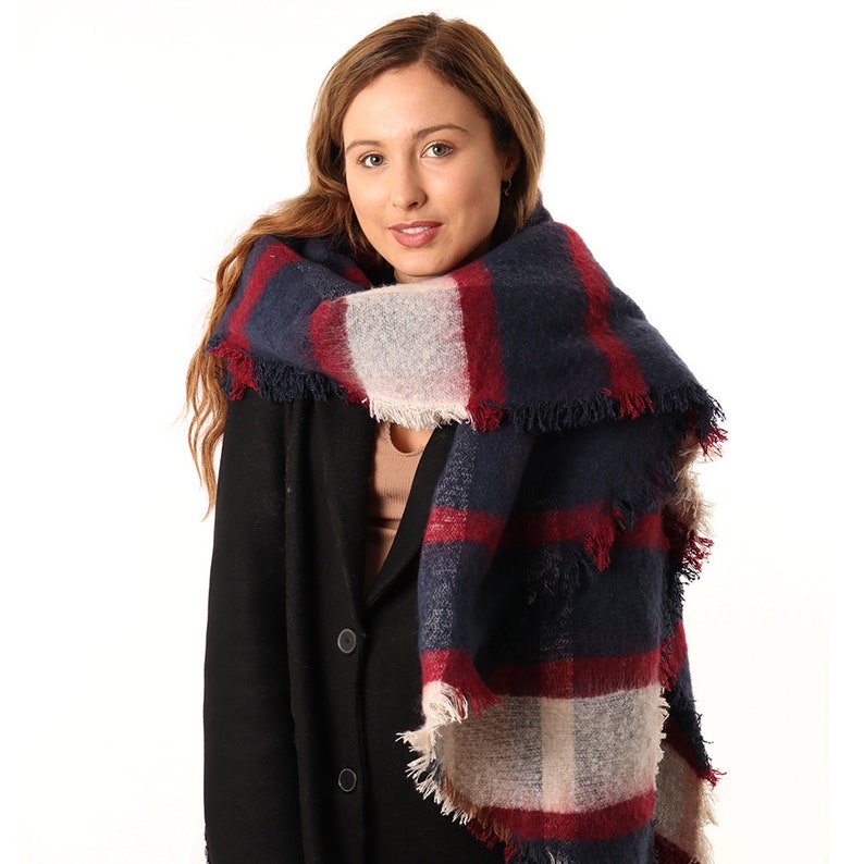 navy blue and burgundy scottish tartan blanket scarf being worn by a model