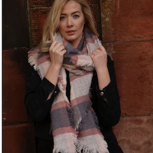 model wearing a light pink tartan warm winter scarf