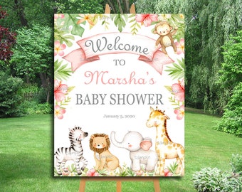 Puede incluir: Bienvenido al Baby Shower de Marsha con una cinta rosa, animales de la selva y flores. La fecha 5 de enero de 2020 está impresa en el cartel.