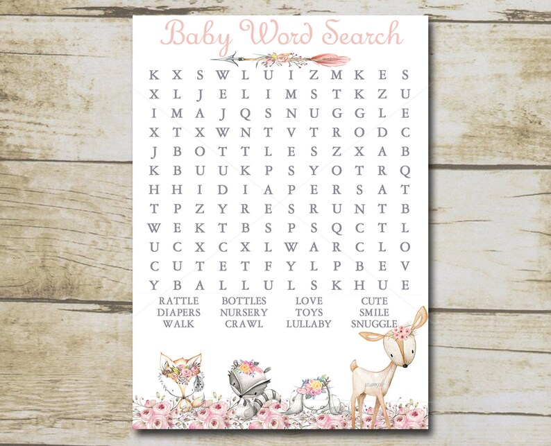 May include: A printable baby word search game with a pink and gray color scheme. The word search features a woodland theme with a fox, raccoon, and deer. The words to find are: rattle, bottles, diapers, nursery, walk, crawl, love, toys, lullaby, cute, smile, and snuggle.