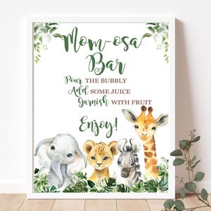 May include: A printable sign for a "Mom-osa Bar" with a jungle theme. The sign features a giraffe, a zebra, a lion, and an elephant, all with watercolor-style illustrations. The text on the sign reads "Mom-osa Bar", "Pour the bubbly", "Add some juice", "Garnish with fruit", and "Enjoy!"