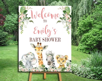 Puede incluir: Bienvenido a la fiesta de bienvenida al bebé de Emily con un fondo rosa y detalles florales. El cartel presenta una jirafa, un elefante, una cebra y un león con coronas de flores.