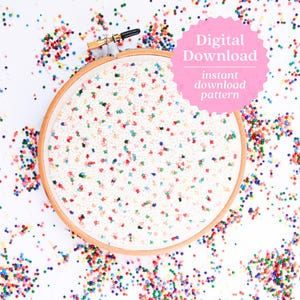 May include: A wooden embroidery hoop with a white fabric design speckled with colorful beads. The image includes a pink circle with the text "Digital Download instant download pattern" and scattered beads.