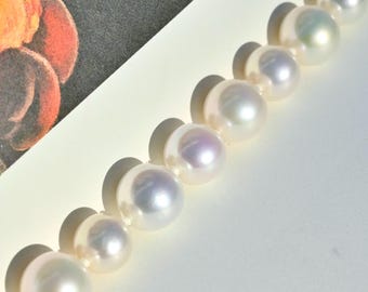 White Freshwater Pearl Bracelet:  7-inch Wrist Size, Sterling Silver Clasp, 10-12mm, AAA, Round