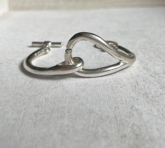 Vintage Silver Tone Interlocking Loop Bangle Brac… - image 1