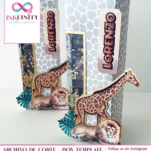 May include: Two tall, decorative boxes with a safari theme. Each box features a giraffe and lion cutout, a clear panel with gold confetti, and a name tag that reads "Lorenzo." The boxes have a gray and white pattern.