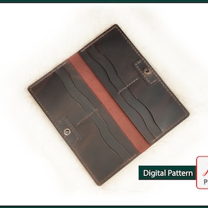 May include: A brown leather wallet with multiple card slots and a billfold. The wallet is open and the interior is lined with a red fabric.