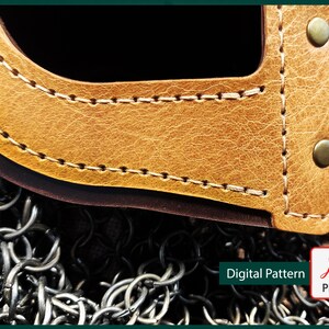 May include: Close-up of a brown leather piece with a stitched edge and metal rivets. The leather is textured and has a worn look. The leather piece is on top of a chainmail background.