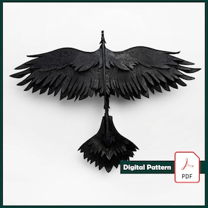 May include: A black bird-shaped wall decoration featuring layered, feather-like panels with an intricate embossed paisley pattern across the wings and tail. The object is displayed in a flat, spread-wing pose. Includes a Digital Pattern PDF icon.