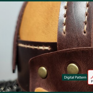 May include: Close-up of a brown leather helmet with tan leather accents and brass rivets. The helmet has white stitching and the text "Digital Pattern PDF" is visible in the lower right corner.