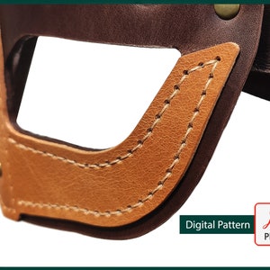 May include: Close-up of a brown leather strap with a tan leather flap. The flap has a stitched edge and a cut-out shape. The text "Digital Pattern" and a PDF icon are visible in the lower right corner.