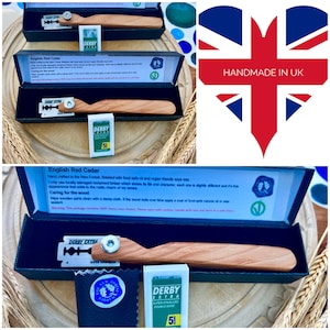 May include: A handmade English Red Cedar straight razor, presented in a black box. The razor features a wooden handle and a silver blade. The box also includes razor blades and a cleaning cloth. The text "HANDMADE IN UK" is visible.