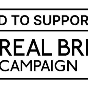 May include: A rectangular black and white graphic with the text "PROUD TO SUPPORT THE REAL BREAD CAMPAIGN". The graphic includes a circular logo with a geometric design.