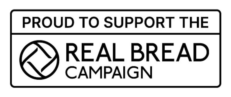 May include: A rectangular black and white graphic with the text "PROUD TO SUPPORT THE REAL BREAD CAMPAIGN". The graphic includes a circular logo with a geometric design.