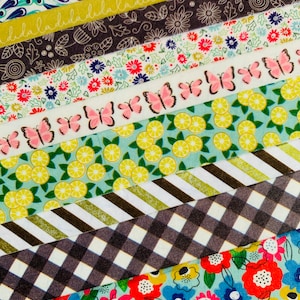 May include: Assortment of colorful washi tapes with various patterns, including butterflies, lemons, flowers, and geometric designs.