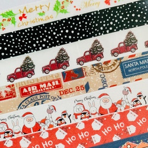 May include: Assortment of Christmas themed washi tapes. The tapes feature designs such as red trucks with Christmas trees, Santa Claus, penguins, and a repeating pattern of "Ho Ho Ho".