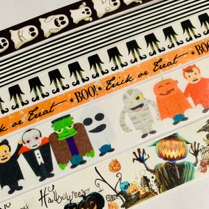 May include: Five rolls of Halloween themed washi tape. The tapes feature ghosts, witches' legs, monsters, pumpkins, and the text "BOO! Trick or Treat" and "Happy Halloween".