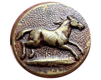 May include: A round, brass button with a raised image of a horse running to the right. The horse is in a relief design and the button has a textured surface.