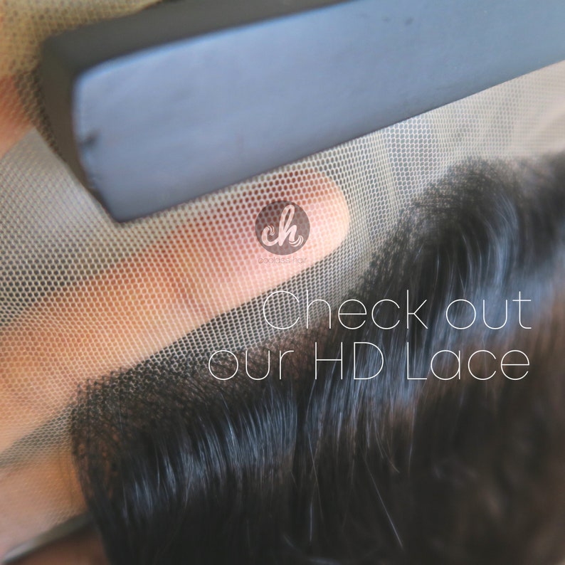 May include: Close-up of a black lace wig with a fine mesh, showing the hair texture and the lace material. The text "Check out our HD Lace" is visible in the image.