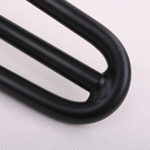 May include: Black metal hairpin leg with a triple-prong design. The leg is curved at the top and has a smooth, matte finish.
