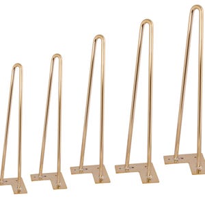 May include: Set of six gold-colored hairpin legs in varying heights. Each leg features a bent top and a flat, L-shaped mounting plate with pre-drilled holes for easy attachment to a tabletop or other surface. Ideal for DIY furniture projects.
