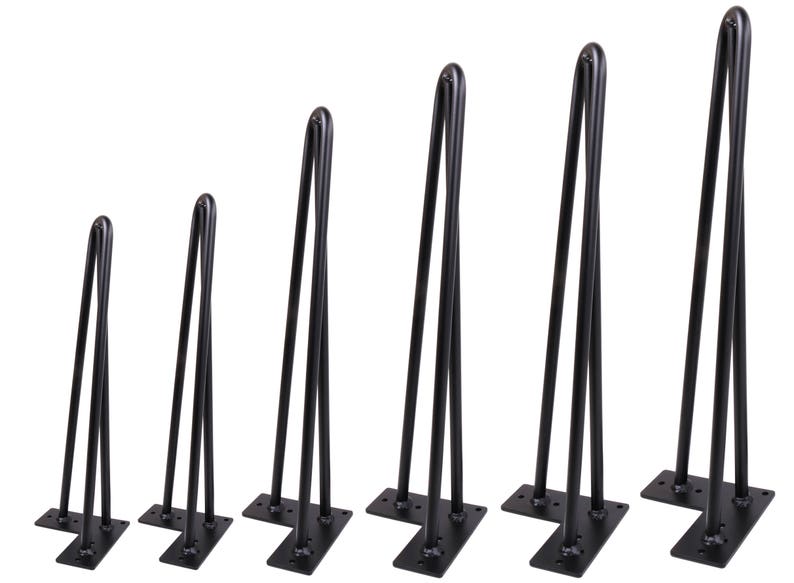 May include: Set of six black metal hairpin legs in various sizes. The legs are made of sturdy metal and have a classic hairpin design. They are perfect for adding a modern touch to furniture.