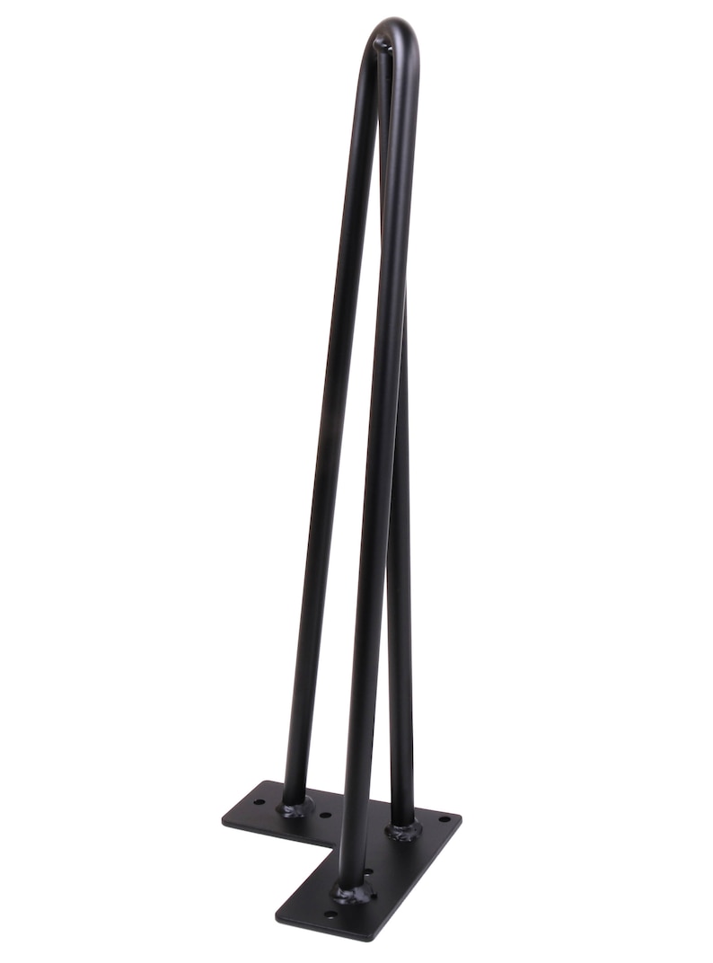 May include: Black metal hairpin legs for furniture. The legs are in an L-shape with a rounded top and a flat base. The legs are approximately 16 inches tall.