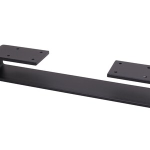 May include: Black metal shelf bracket with two mounting plates. The bracket is curved and has a flat surface.