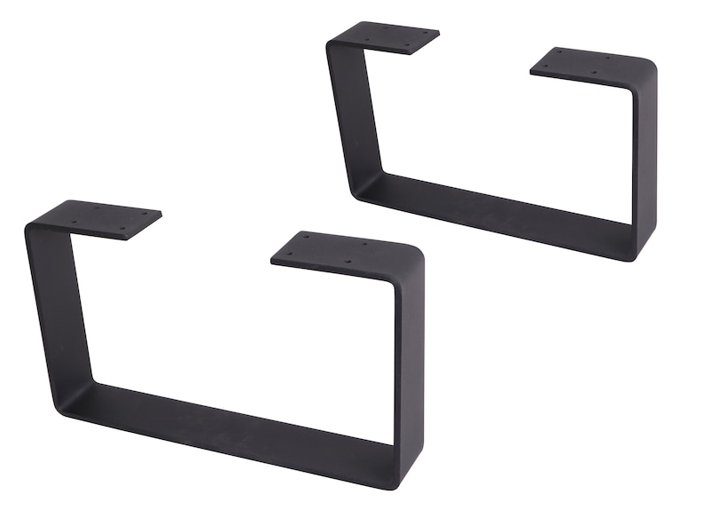 May include: Two black metal table legs with a rectangular shape. Each leg has a flat top and bottom, and a curved side.