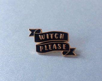 May include: Black and gold enamel pin with a black banner that reads "Witch Please".