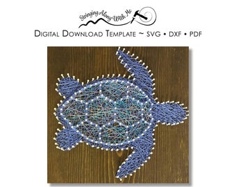 May include: A blue and white string art design of a sea turtle on a wooden background. The design is made with nails and string, and the turtle is outlined in blue string. The background is a dark brown wood.
