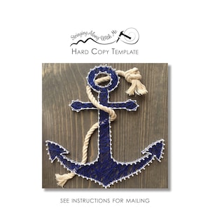 May include: A blue and white string art anchor on a wood background. The anchor is made with string wrapped around nails. The string art is a popular craft project.