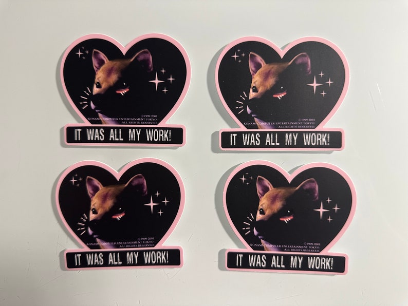 May include: Four stickers with a heart shape and a pink border. Each sticker features a brown dog illustration against a black background with the text "IT WAS ALL MY WORK!". The stickers have a retro aesthetic.