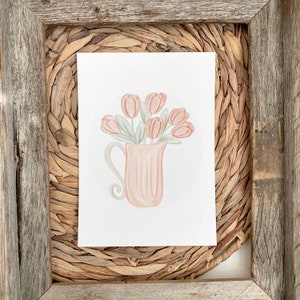 May include: A watercolor illustration of a pink pitcher filled with a bouquet of peach-colored tulips. The pitcher has a delicate handle and is sitting on a white background.